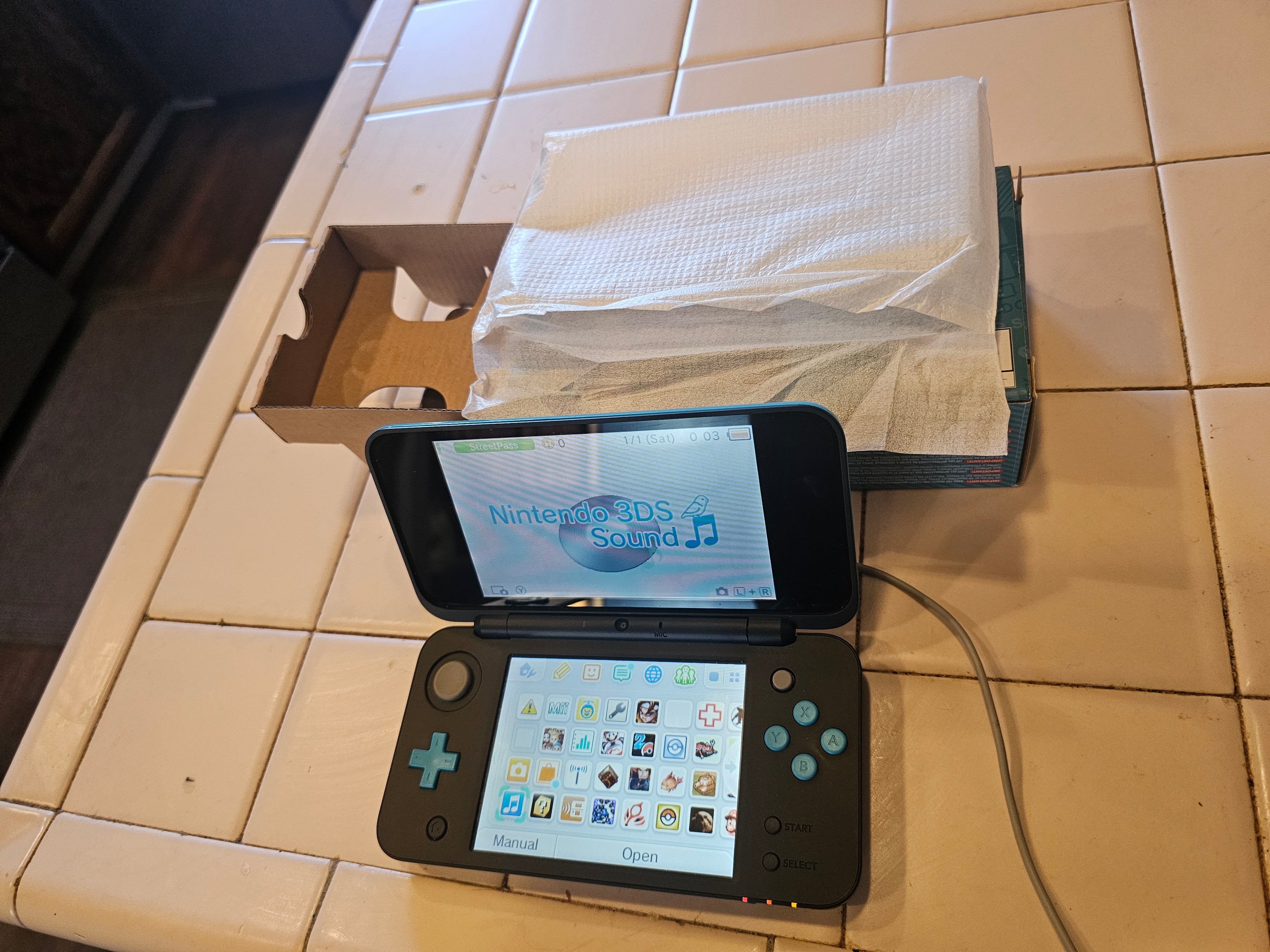 new 2ds xl turquoise 128gb with games