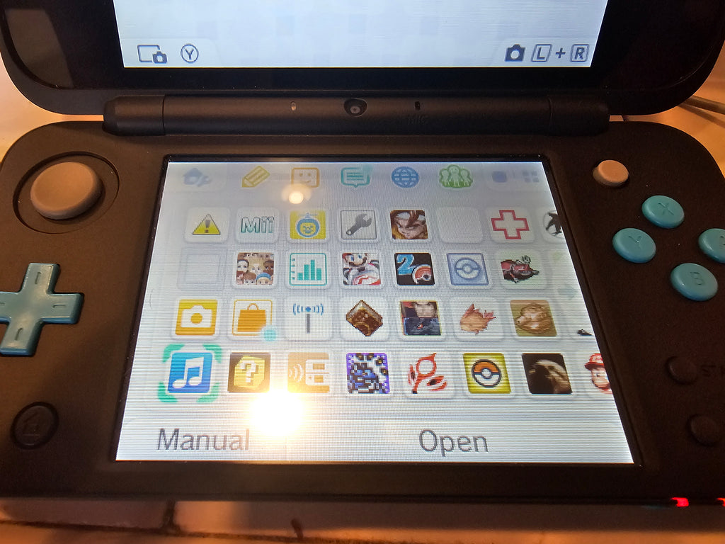 new 2ds xl turquoise 128gb with games